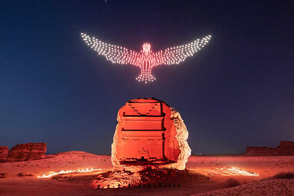 Sculptures of light draw the skies above the ancient UNESCO World heritage Site of Hegra in AlUla, the Majestic Desert City in Northwest Arabia